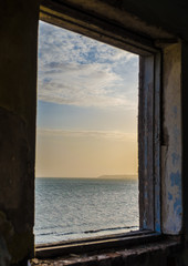 sea landscape in the window of the destroyed room