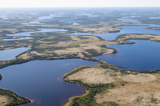 Aerial view of lakes and an esker, a ridge formed by sediment deposited during the last Ice Age, in northern Manitoba, Canada