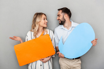 Attractive young couple standing isolated