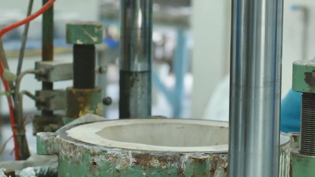 Making ceramic bowl by machine in ceramic factory