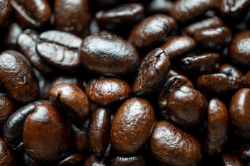 Close up of group black coffee beans. Strong black espresso, Grains of coffee background, texture