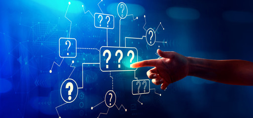 Question marks with hand pressing a button on a technology screen
