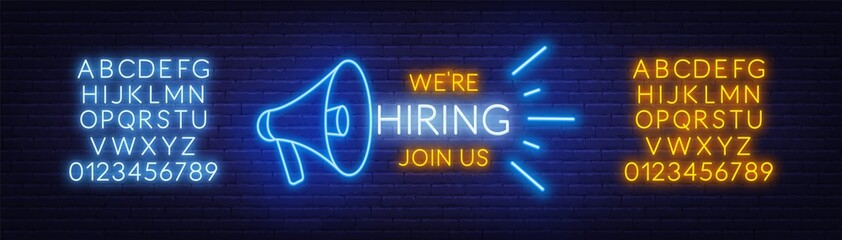 Obraz premium Neon sign we are hiring - join us on the brick wall background. Light poster or banner for recruiting. Template for design. Vector.