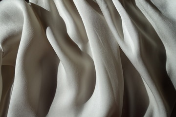 Thin grey chiffon fabric in soft folds