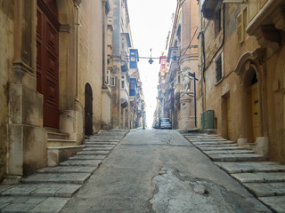 Fototapeta na wymiar Quiet streets of the capital of Malta - Valletta. The Archbishop Street.