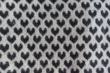 Thick woollen fabric with black hearts pattern on white