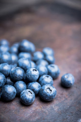 Ripe blueberries on the rustic background. Selective focus. 