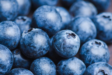 Ripe blueberries on the rustic background. Selective focus. 