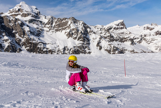 Little girl smiling on the ski slopes