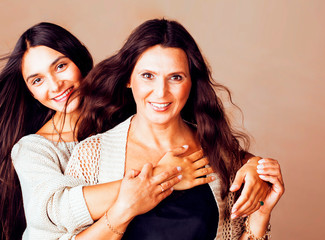 cute pretty teen daughter with mature mother hugging, lifestyle people concept