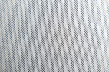 A uniformly lit white fabric texture with soft shadows.