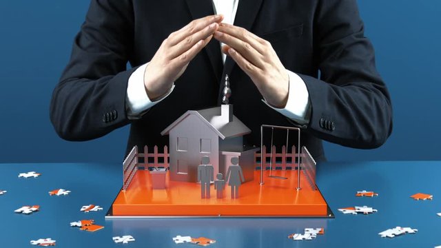 Mann in Anzug vor Schreibtisch hält seine schützende Hand über ein kleines Haus und seine Familie in 3D