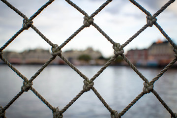 Fototapeta premium Netted fence with blurred background