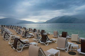 Cloudy summer day on the beach.  Montenegro, Adriatic Sea, view of Bay of Kotor near Tivat city