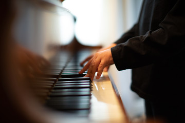child plays the piano