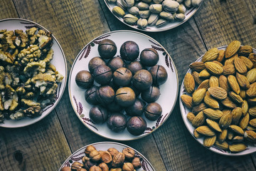 assorted nuts on a wooden background