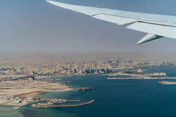 Fototapeta na wymiar Aerial view of Doha, Qatar from the airplane window.