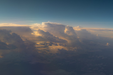 Beautiful clouds with a blue sky. View from the airplane window