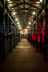 Outdoor walkway with red lights