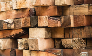 raw wood lumps pile together background