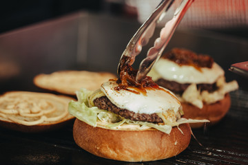 Cook hands preparing and making hamburger.