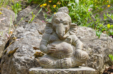 Fototapeta premium Ganesh deity with elephant head stone statue