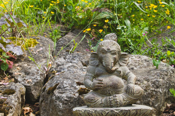 Ganesh stone statue in a garden