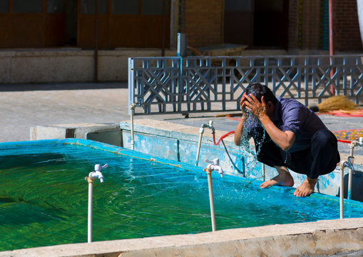 Man Making Ablutions In Dar Ol Ehsan Mosque, Sanandaj, Iran