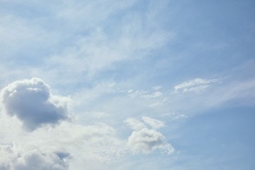 Naklejka na ściany i meble Light white clouds on peaceful blue sky with copy space