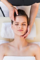 Naklejka premium Young female masseur making massage for young client.