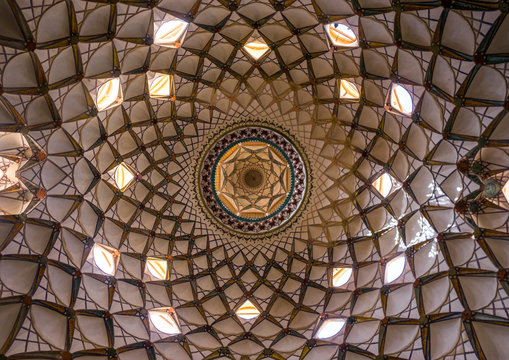 Ceiling with its intricate and elaborate patterns and internal stainless glass dome the boroujerdi house, Isfahan province, Kashan, Iran