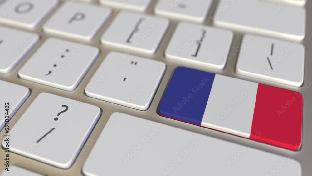 Poster key with flag of austria on the computer keyboard switches to key with flag of france, translation o