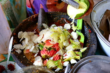 shaved rujak. Indonesian fruit salad with hot spicy sauce. the process of making from kneading spices, until served