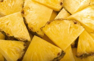 heap of slices of pineapple background