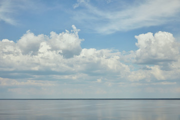 Landscape with light blue sky and river