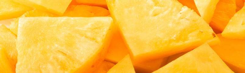 heap of slices of pineapple background banner