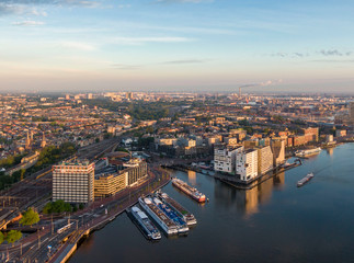 Fototapeta na wymiar Aerial view of central part of Amsterdam, new district of IJdock and canal cruise ships, Netherlands