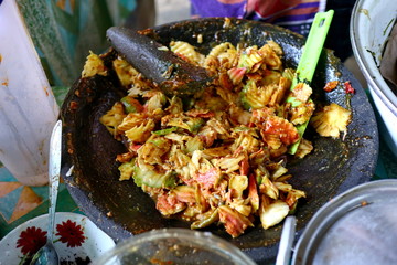 shaved rujak. Indonesian fruit salad with hot spicy sauce. the process of making from kneading spices, until served