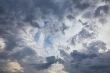 dark clouds on blue sky background with copy space