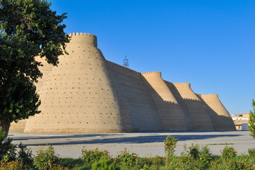 Wall and towers of the ancient citadel in Bukhara "Ark citadel", Uzbekistan.