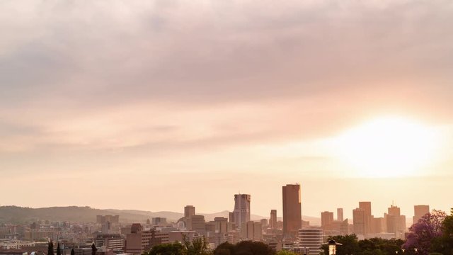 Dramatic timelapse sunset over Pretoria city centre/CBD/city of Thswane, iconic scenic view, South Africa showing city skyline, 4K 25p.