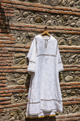 Christian piligrim white shirt clothes for bathing in Georgia.