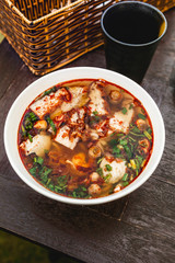 Banh Canh Cha Ca, delicious Vietnamese noodle soup with fish cake, served in a small restaurant in Dalat, Vietnam