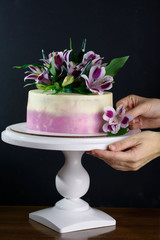 Delicious cake with fresh flowers