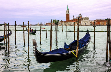 Fototapeta na wymiar Venice, Italy: Gondola on Grand canal. Saint George church (San Georgio basilica) island view.