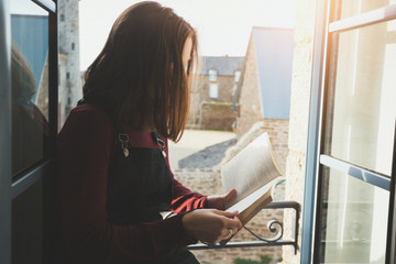 girl is reading a book