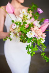 Stylish wedding bouquet in the hands of the bride
