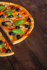 pizza olives, mushrooms, tomato, cheese, basil, sauce and more. top view. food background. copy space for text and lettering