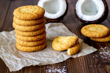 Coconut cookies on a brown wooden background. Coconuts.