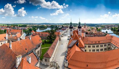 Fototapeta na wymiar Telc city with historical buildings, church and a tower. Unesco world heritage site, South Moravia, Czech republic. View from tower.